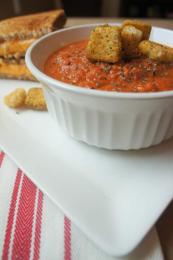 Creamy Tomato soup is the perfect fall food that will last throughout the winter months. Served with a grilled cheese sandwich, this is the ultimate comfort food!