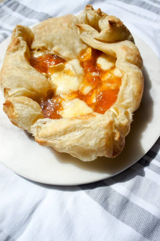 Baked Brie and Apricot Jam can easily be made in a puff pastry for a crowd, or a small ramekin for a few. Easy, delicious game food.