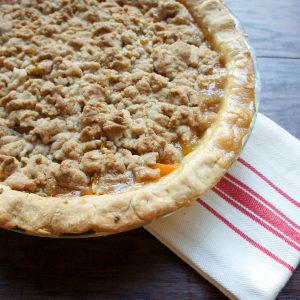 Peach Crumble Pie. The perfect cross between summer and fall. Serving with a big scoop of vanilla ice cream!