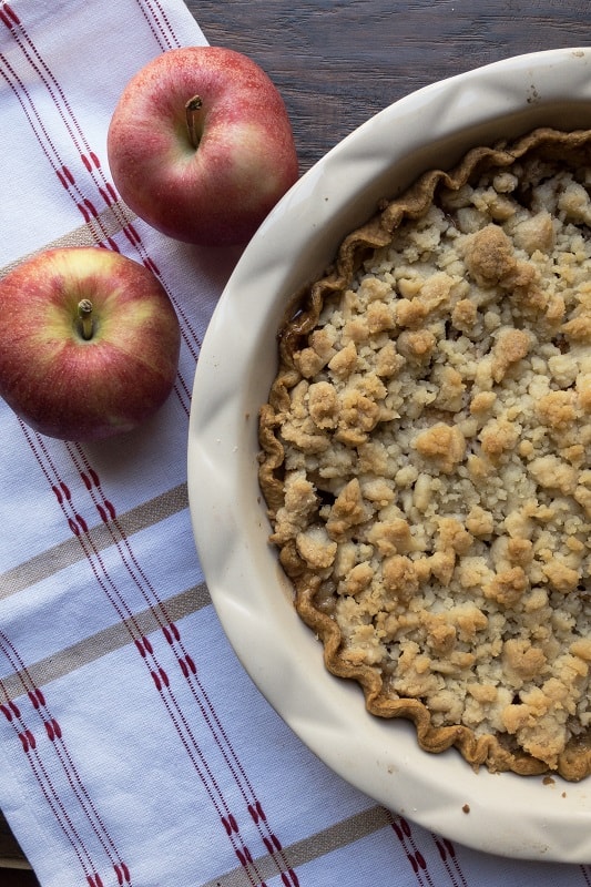 A classic, Thanksgiving day Apple Crumble Pie. Tart apples, lots of cinnamon sugar, and buttery, sugary topping! So delicious!