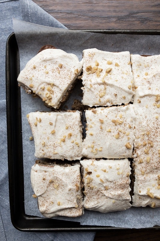 Applesauce Spice Cake made with a boxed Duncan Hines mix is the perfect holiday, fall themed treat. A great dessert for Thanksgiving, this sheet cake for a crowd is topped with whipped cinnamon buttercream.