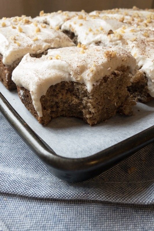 Applesauce Spice Cake with Cinnamon Buttercream made with a boxed Duncan Hines mix is the perfect holiday, fall themed treat. A great dessert for Thanksgiving, this sheet cake for a crowd is topped with whipped cinnamon buttercream. 