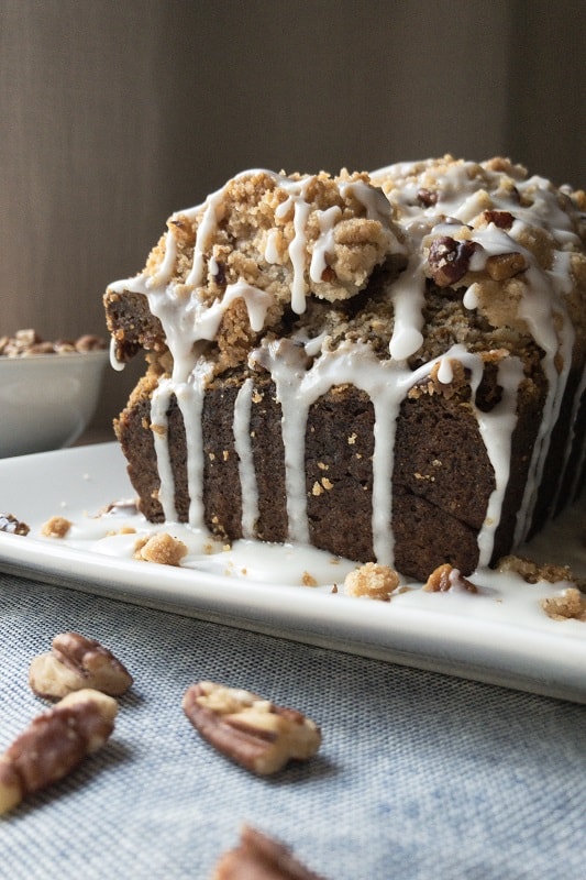 Glazed Pumpkin Pecan Streusel Loaf. A perfect cross between a cake and bread, with all the Fall flavor and a heavy drizzle of glazed, nutty goodness! #pumpkinspice #fall