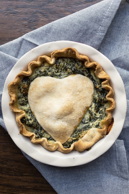 A savory pie filled with cheesy Ricotta and Parmesan and loads of green leafy veggies. A perfect holiday appetizer, whether Thanksgiving or Christmas!