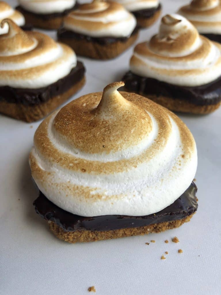 These are the perfect handheld dessert for fall! Mini campfire S'mores Pies are the perfect blend of sweet, crunchy and smooth!