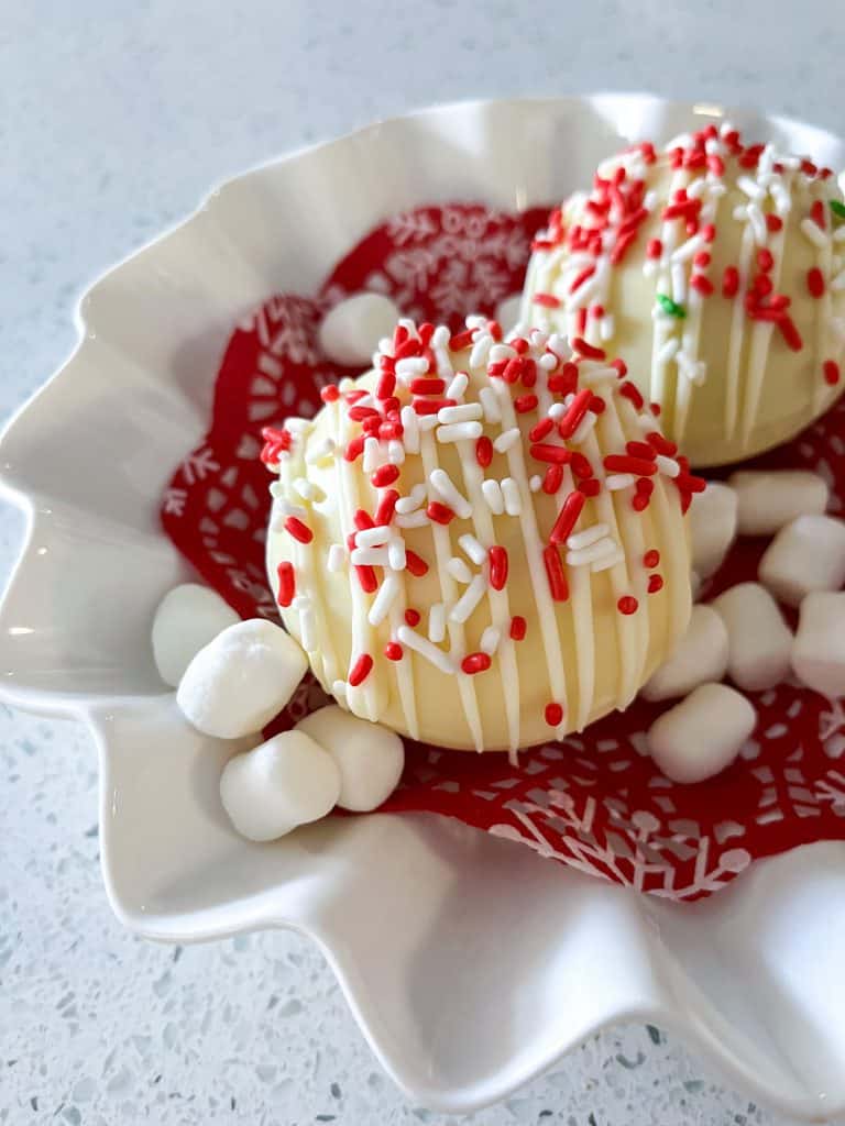 two white hot chocolate bombs