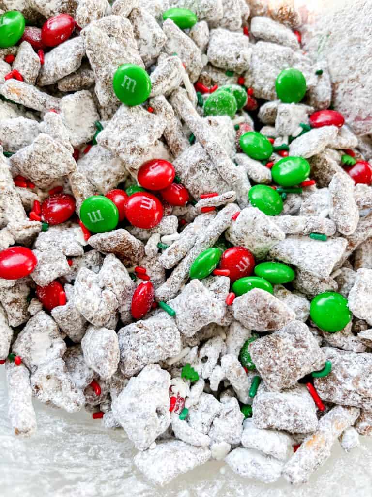 Reindeer food puppy chow is the perfect Christmas treat full of peanut butter, chocolate, M&M's and lots of crunchy salty treats too!