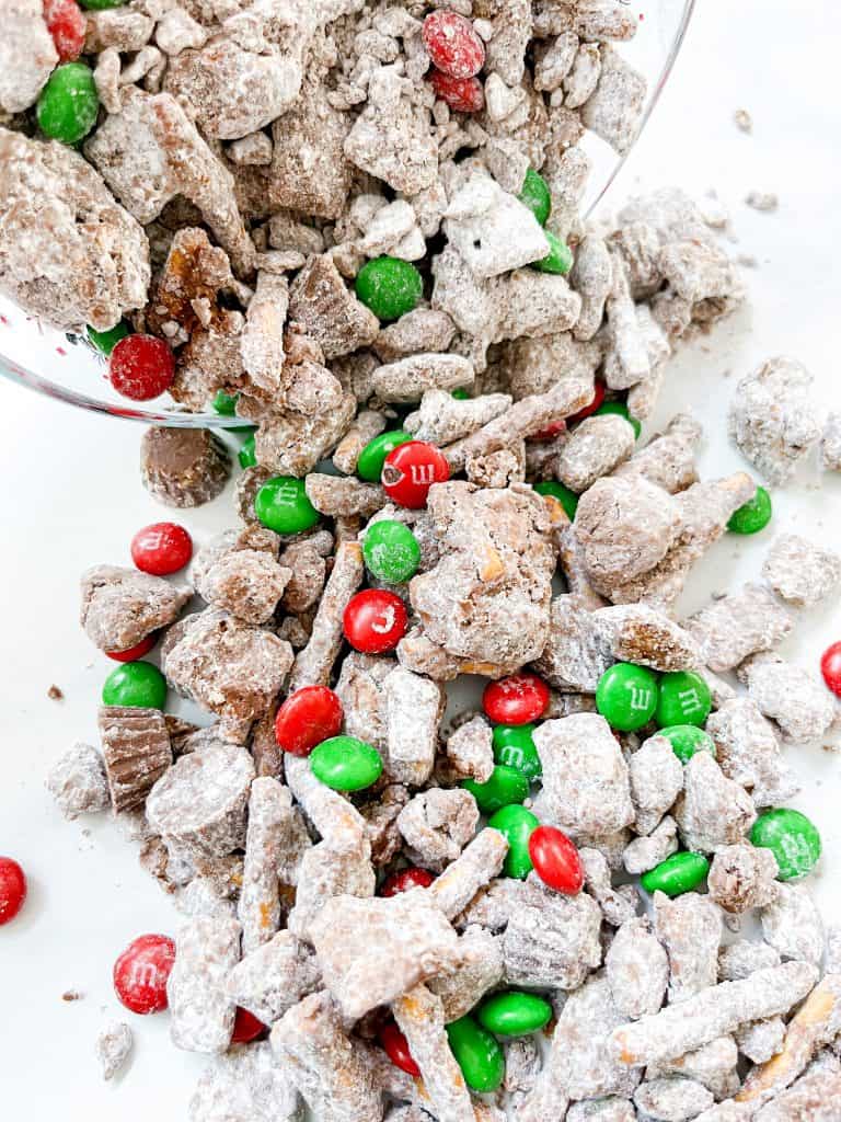 Reindeer food puppy chow is the perfect Christmas treat full of peanut butter, chocolate, M&M's and lots of crunchy salty treats too!