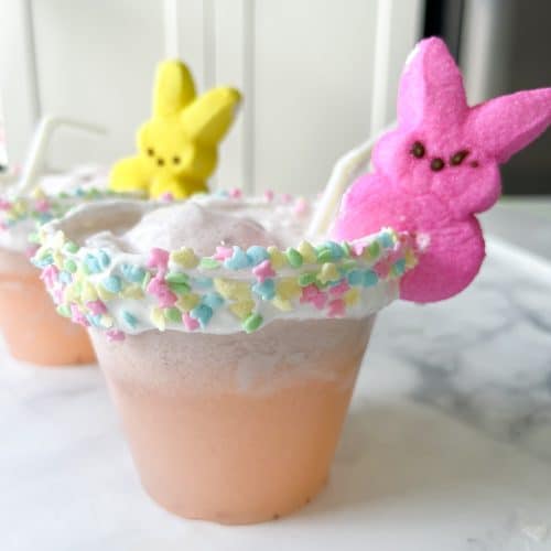 strawberry lemonade punch cups with peeps decor and a whipped cream rim